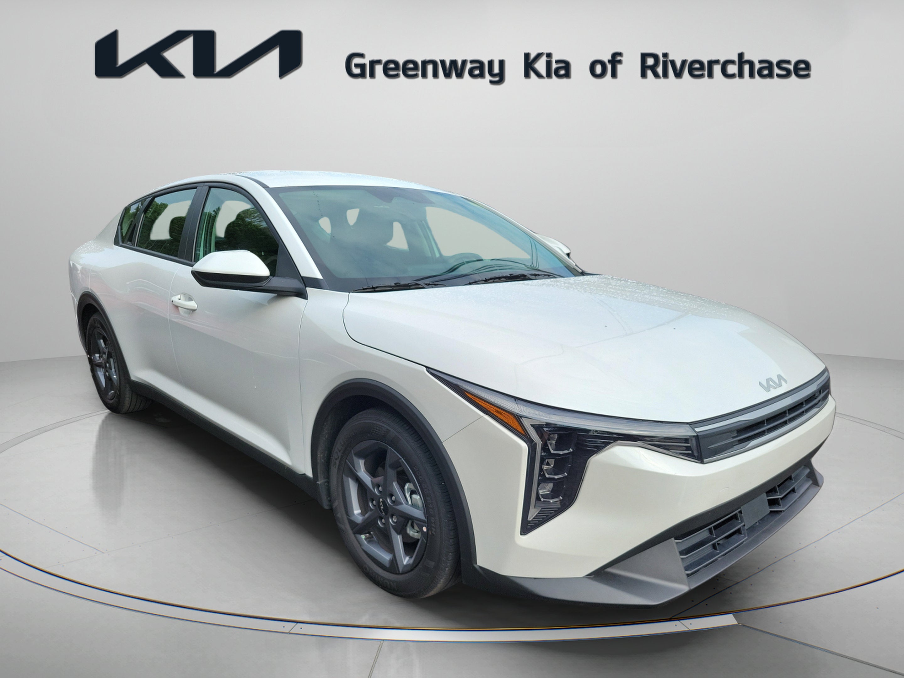 2026 Kia K4 LXS in Snow White Pearl — front three-quarter view