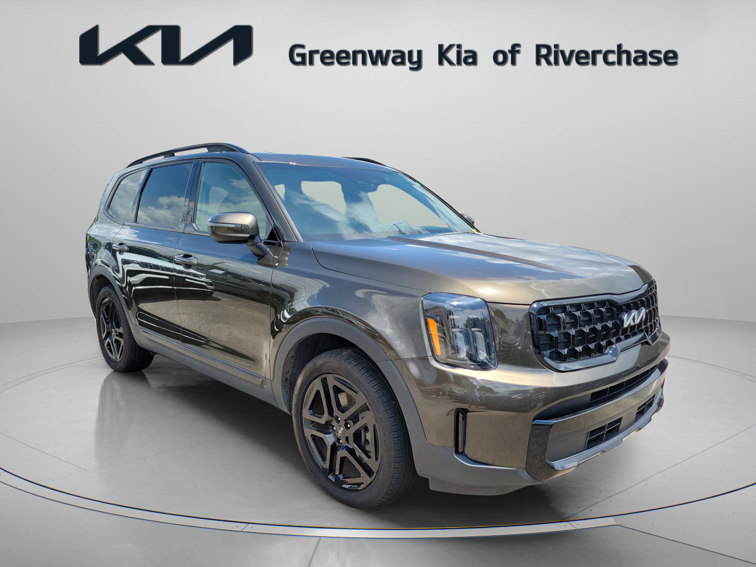 2024 Kia Telluride EX X-Line in Dark Moss — front three-quarter view