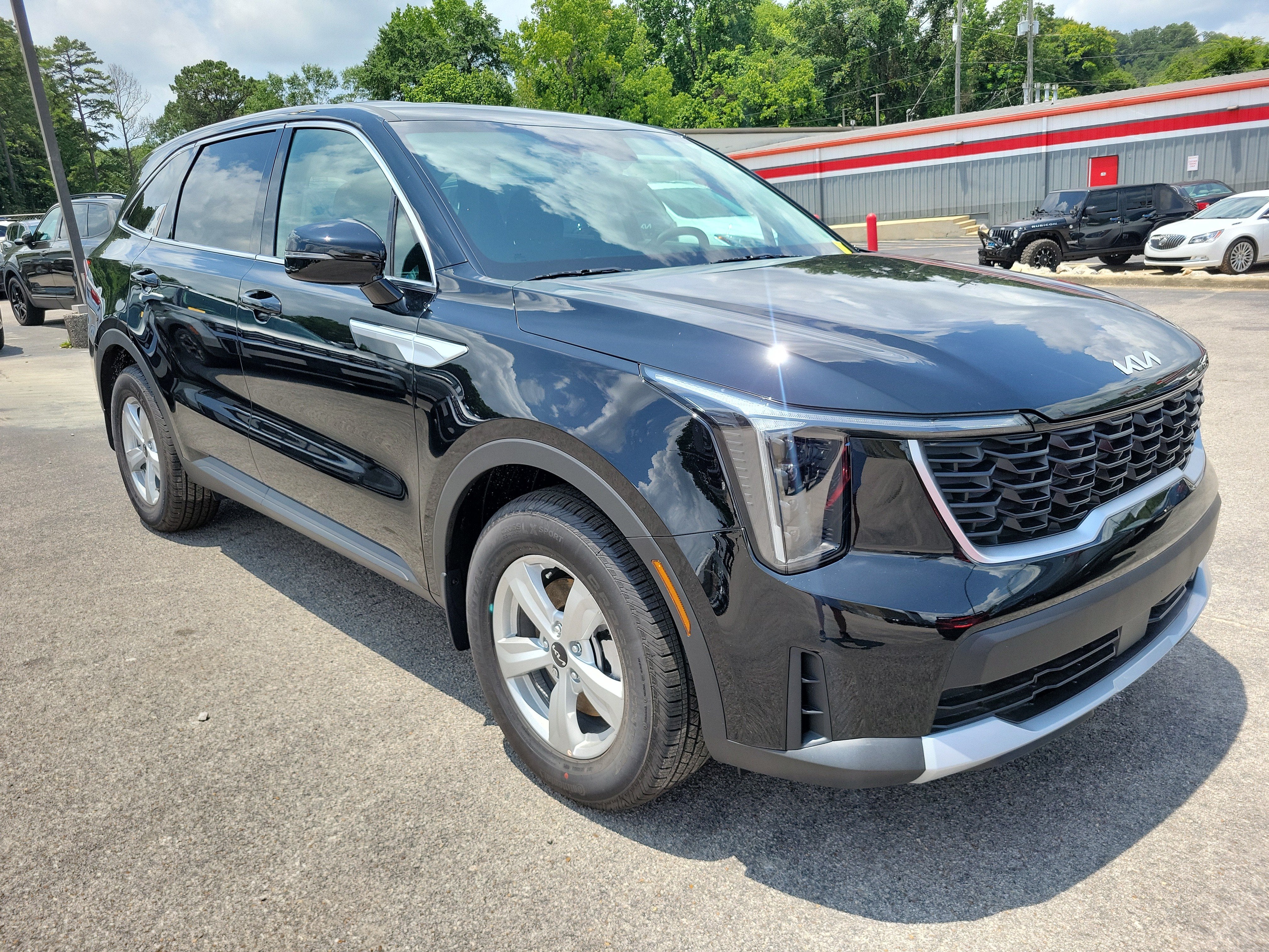 2026 Kia Sorento LX in Ebony Black — front three-quarter view