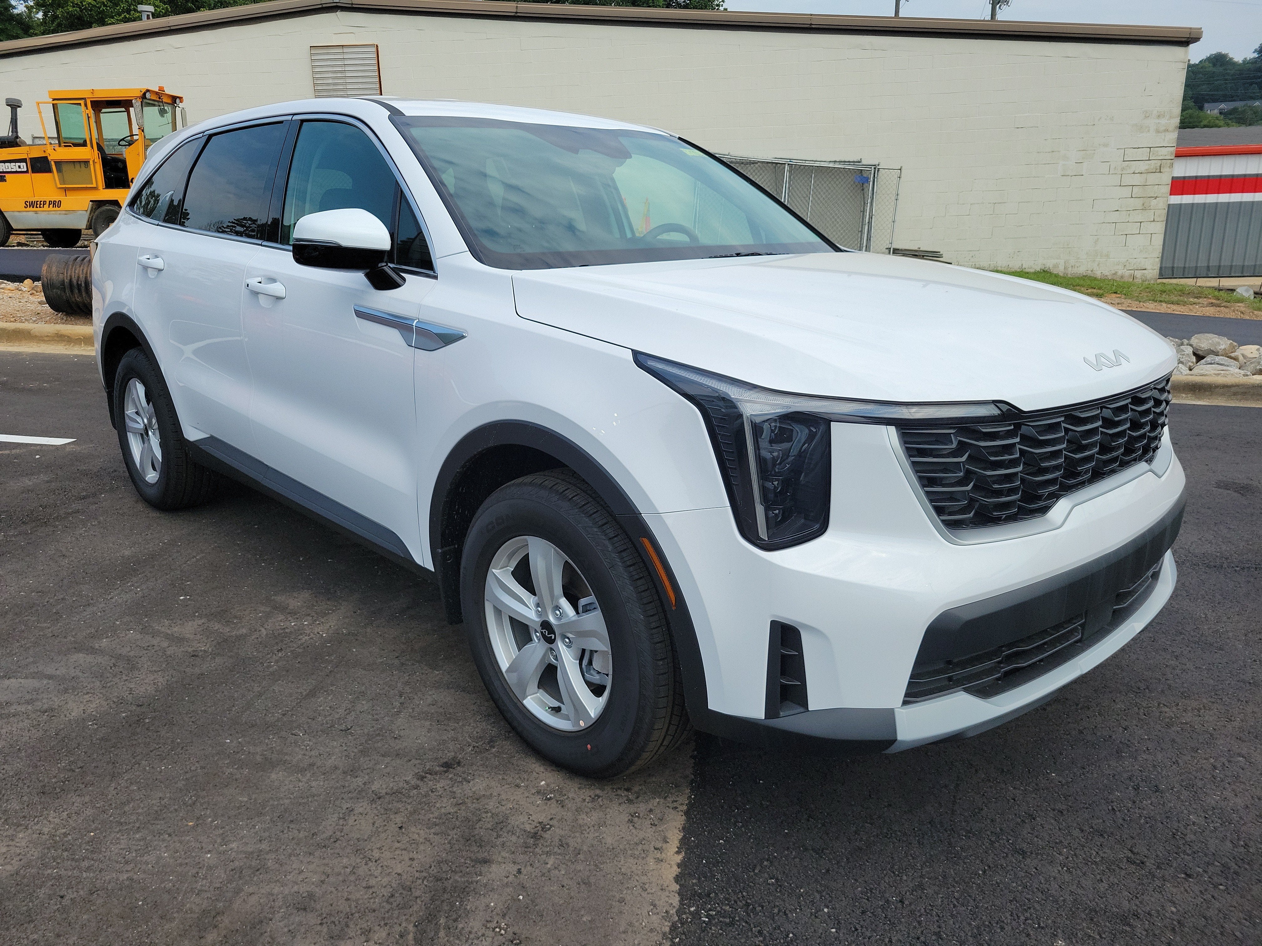 2026 Kia Sorento LX in Glacial White Pearl — front three-quarter view