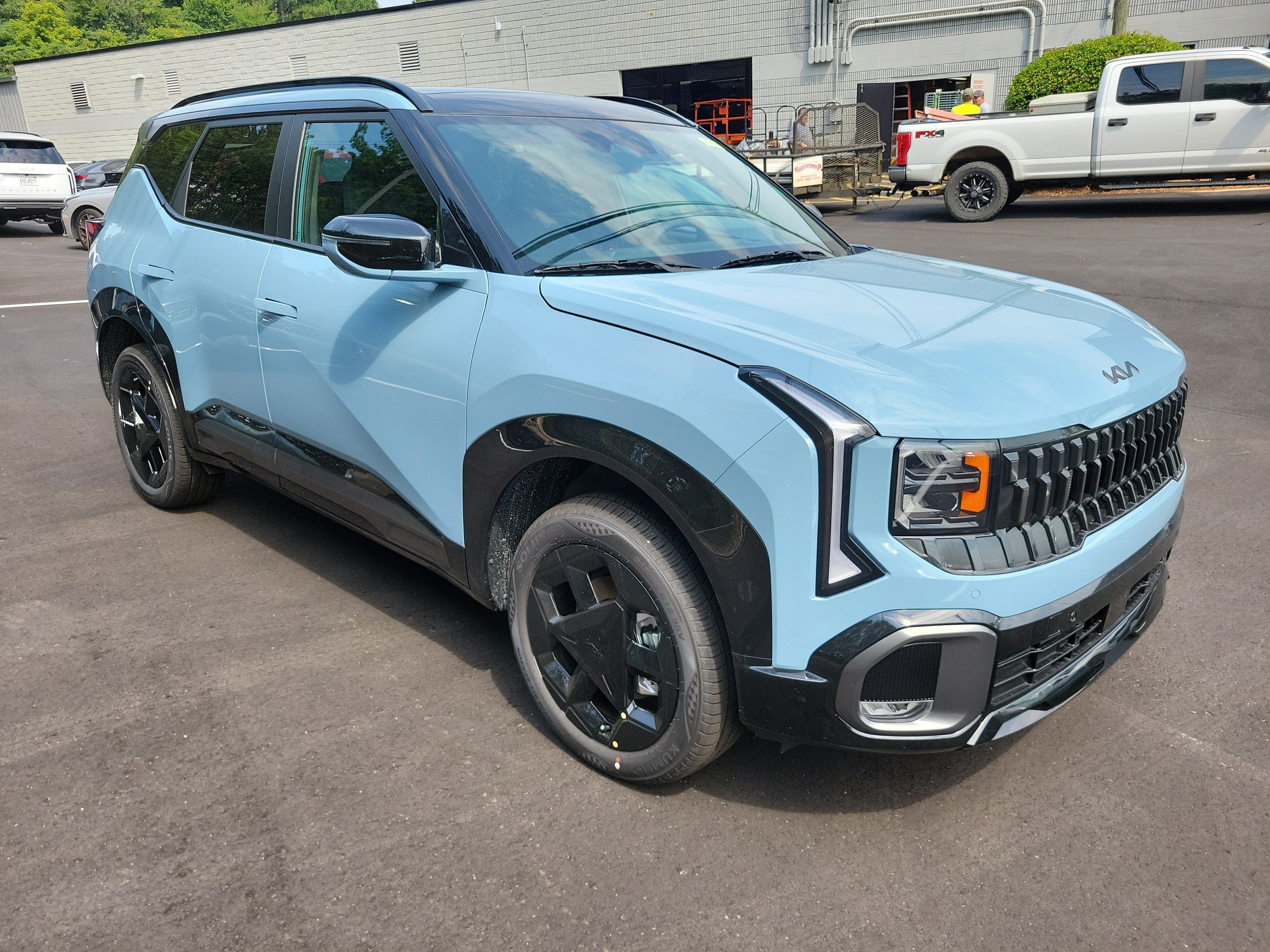 2027 Kia Seltos X-Line in Frost Blue — front three-quarter view