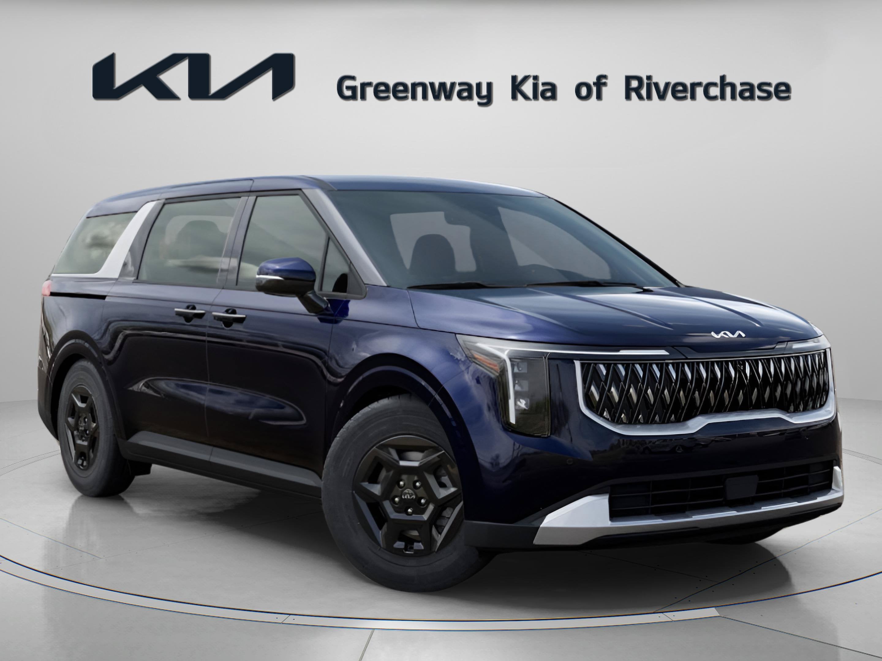 2026 Kia Carnival LXS in Deep Chroma Blue — front three-quarter view
